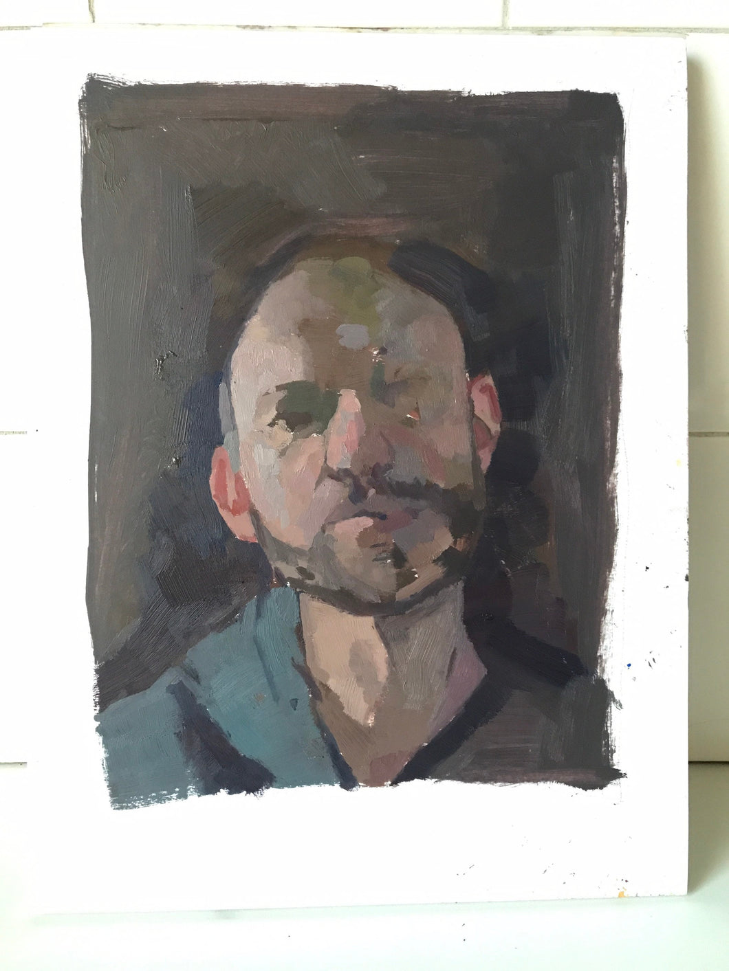 Original oil painting on paper. Portrait of a man in chiaroscuro